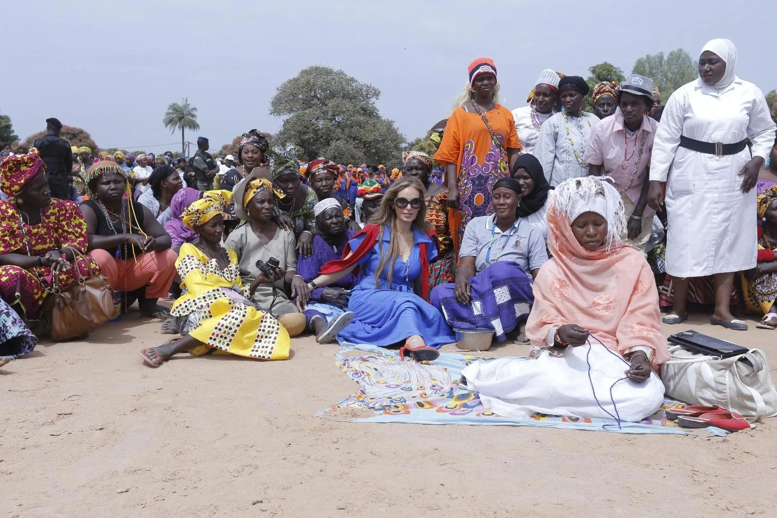 • Dr Kelej (seated third from right) with some beneficiaries of Merck Foundation