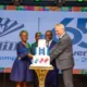 • Mr Ahi (second from left), Mr Parent (third from left), Mr Born (fourth from left), and Mrs Duplan, Board Chairperson (left), cutting the anniversary cake