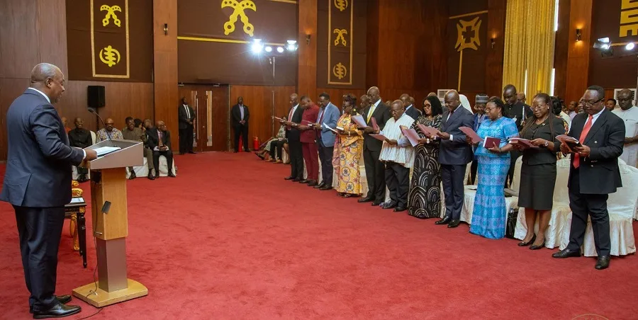 • President Mahama (left) swearing in the members